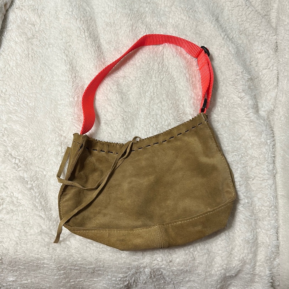 Unique leather bag, brown leather with neon orange strap. Makes a statement!